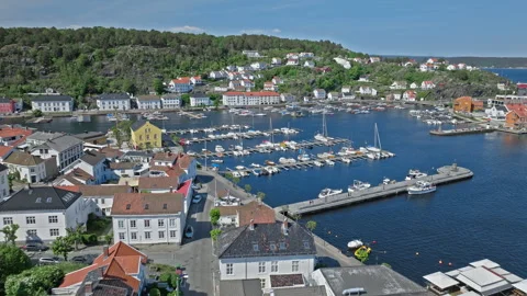 Aerial view of Risor Norway harbour with boats and waterfront buildings. Stock Footage 328125628