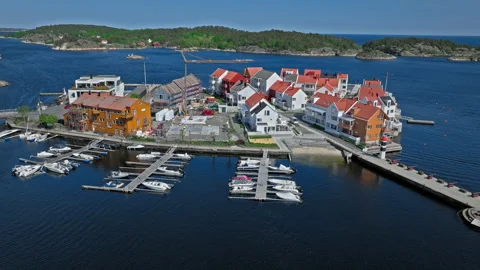 Aerial view of Risor Norway marina boats and colourful waterfront buildings. Stock Footage 328125537