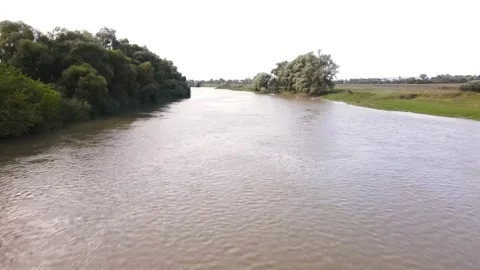Aerial view of the river after storm couple having picnic at riverside Vídeos de archivo 141355897