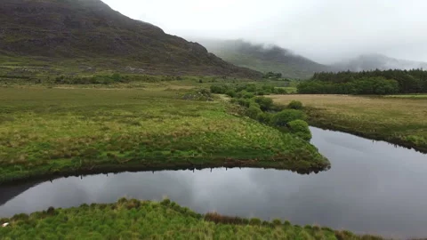 Aerial View River and Bogs in Deserted Valley Ireland Stock-Footage 242849534