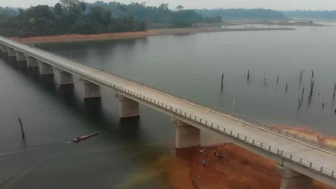 Aerial view of river and bridge with boat, Laos. Stock Footage 345228891