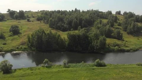Aerial view of River and Fields. Low Aerial Flight Over Stream Stock Footage 111229966