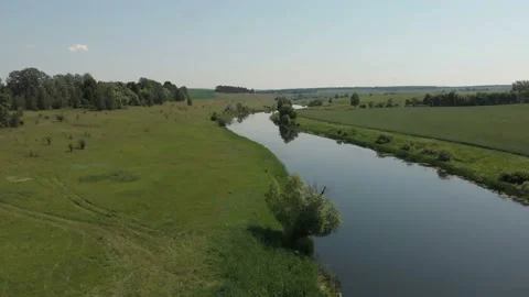 Aerial view of River and Fields. Low Aerial Flight Over Stream Stock Footage 111230693