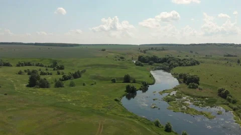 Aerial view of River and Fields. Low Aerial Flight Over Stream Stock Footage 111230834