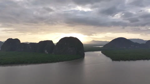 Aerial view of river and mountains at sunrise, Thailand 動画素材 339482792