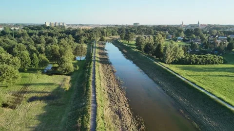Aerial View of River and Surrounding Green Fields Video stock 291121840