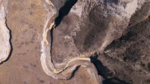 Aerial view of river in badlands Stock Footage 306092750