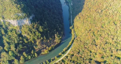Aerial view of river bend through forest, Slovenia Stock Footage 324525599