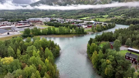 Aerial View of a River Bend, Trees and Valley Buildings Vídeos de archivo 347265454