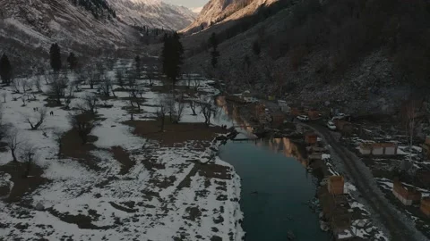 Aerial view of a river in between the mountains covered with Stock Footage 172522122