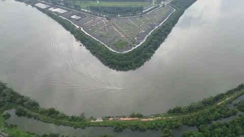 An aerial view of a river with a boat in it Stock Footage 253662161