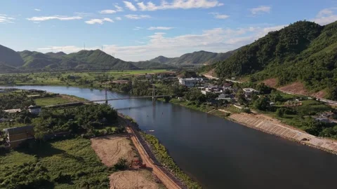 Aerial view of river bridge and village in Vietnam Stock Footage 339753602