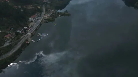 Aerial view of river Cavado,following the clouds in the reflection of the water Stock Footage 235365786