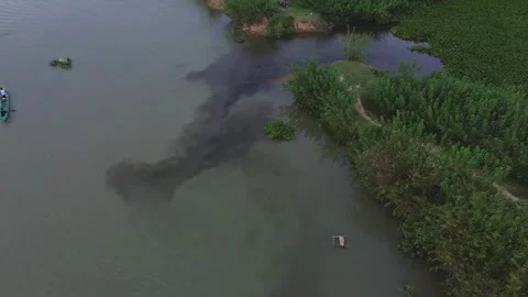 Aerial view of river contaminated with black hazardous liquid Stock Footage 311985271