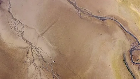 Aerial view: River drying up in sandy desert like environment. Dry landscape Stock-Footage 144182147