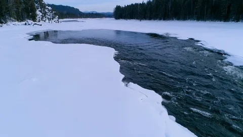 Aerial view river escapes from under the ice 1 Stock Footage 88159974