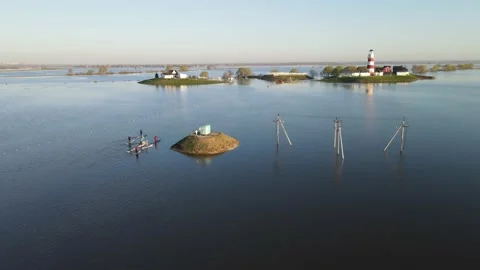 Aerial view of the river flood, lighthouse and athletes Stock Footage 191006378