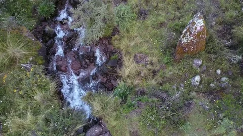 Aerial View of river flowing down the mountain Video stock 75747845