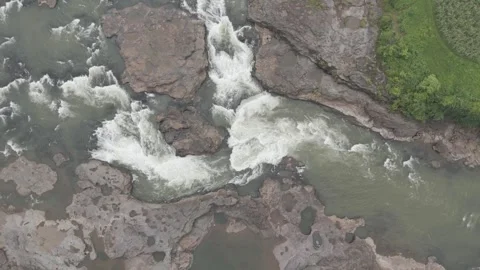 Aerial view of river flowing through the rock area. Video stock 285387492