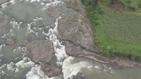Aerial view of river flowing through the rock area. Video stock 285387668