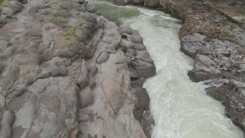 Aerial view of river flowing through the rock area. Stock Footage 285429405