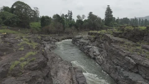 Aerial view of river flowing through the rock area Stock Footage 285430124