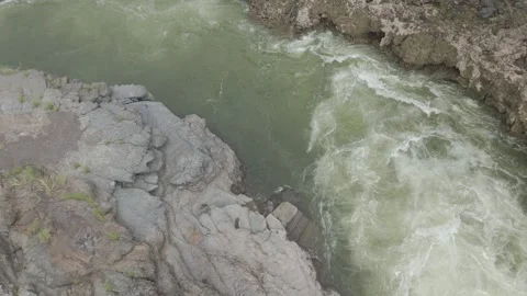 Aerial view of river flowing through the rock area. Video stock 285476237
