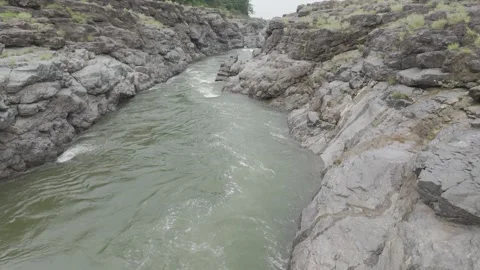 Aerial view of river flowing through the rock area. Stock Footage 285477542