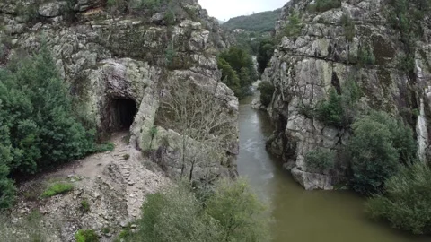 Aerial View of River Flowing Through Majestic Rock Formations Stock Footage 312751986
