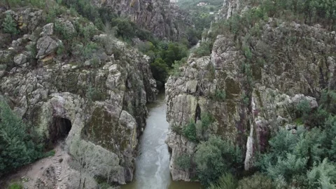 Aerial View of River Flowing Through Majestic Rock Formations Stock Footage 312751997