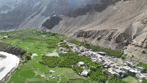 Aerial View of River Flowing Through Tabo Valley with Farms and Settlement Stock Footage 330319523