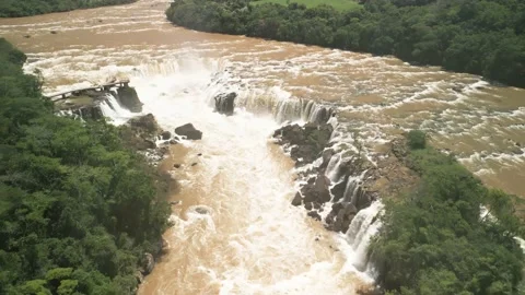 Aerial view of a river flowing into a waterfall. Salto Saudades. 4K. Stock Footage 233219765