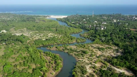 Aerial View: River flows into the Indian Ocean, Kenya Stock Footage 160244801