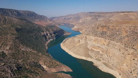 Aerial view river flows through a rocky canyon 4k Stock Footage 330531409