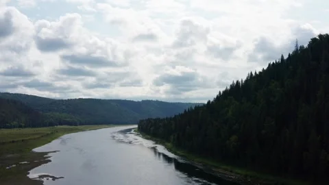 Aerial view of the river in the forest among the hills Stock Footage 252246806