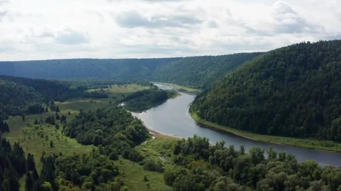 Aerial view of the river in the forest among the hills Stock Footage 252246936