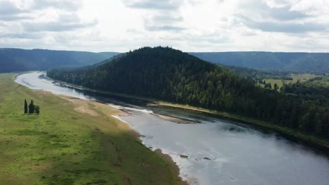 Aerial view of the river in the forest among the hills Stock Footage 252247036