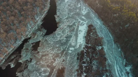 Aerial view of river in forest area in winter 動画素材 148605031