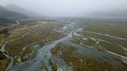 Aerial view of the river forms with the autumn vegetation in new zealand. slow Stock Footage 226900485