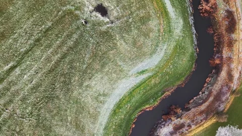 Aerial View of River with green fields Foliage, frost &amp; ice. Yorkshire Dales Video stock 294611516