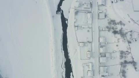Aerial view of the river with ice in the middle of the village Stock Footage 150661136