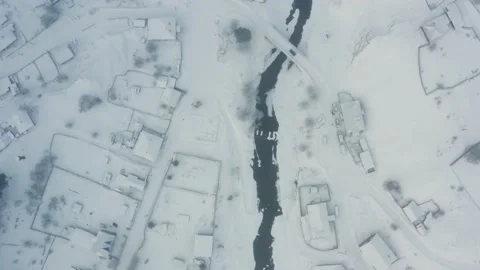 Aerial view of the river with ice in the middle of the village Stock-Footage 150661798