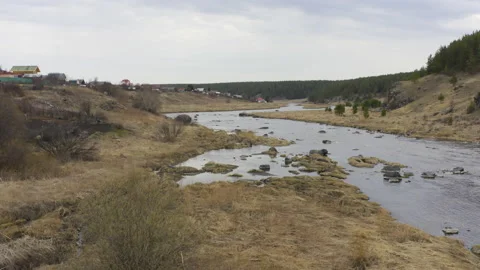 Aerial view of the river with large rocks in the riverbed. Stock Footage 133971352
