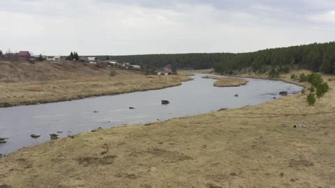 Aerial view of the river with large rocks in the riverbed. Stock Footage 133981874