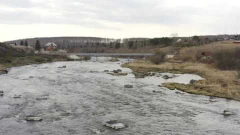 Aerial view of the river with large rocks in the riverbed. Stock Footage 133993327