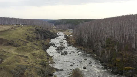Aerial view of the river with large rocks in the riverbed. Stock Footage 134076382