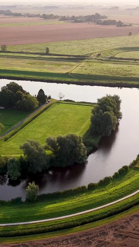 Aerial view of river meandering through rural landscape Stock Footage 327111502
