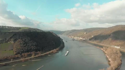 Aerial View Of River With Moving Barges, Trains, And Clouds Above. Stock Footage 297917847