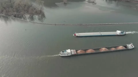 Aerial View Of A River With Moving Barges And Detailed Barge Close-Up. Stock Footage 297918104