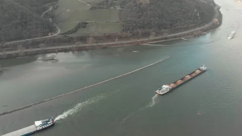 Aerial View Of River With Moving Barges, Trains, And Clouds Above. Video stock 297918175